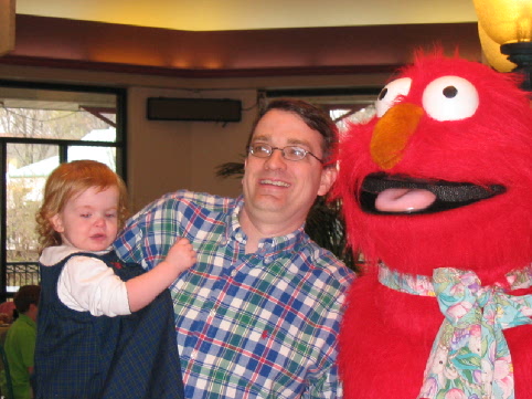 Jane with Dad and Elmo